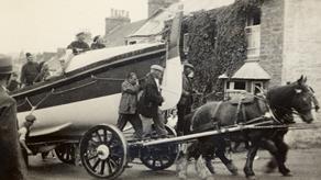 1933: Newquay RNLI’s self-righting class lifeboat,  Admiral Sir George Back,  being towed through the streets on a carriage by horses