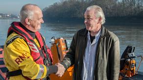 Chiswick crew member John Pooley with Eddie Elgott. The Chiswick lifeboat rescued Eddie when he fell into the River Thames chasing Easy the dog who had slipped his lead. 