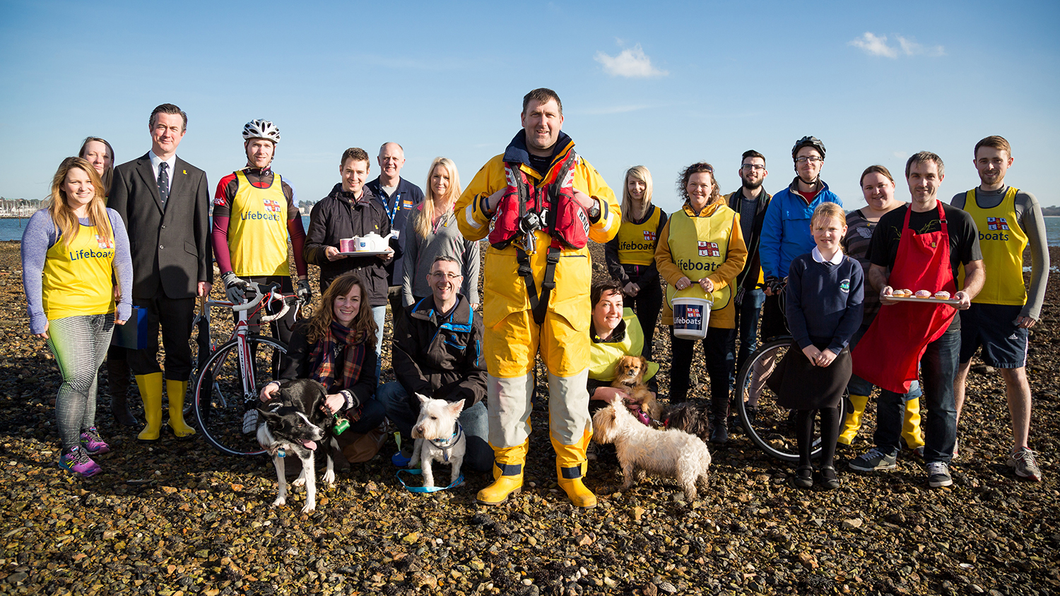 Group shot of fundraisers, including cyclists, runners, bakers, dog walkers and yellow welly wearers.