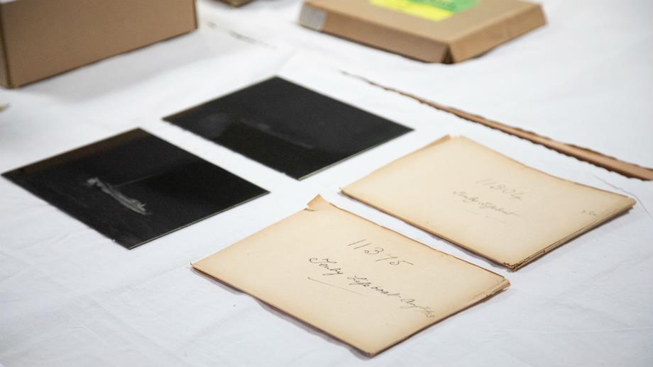 Colour image of glass plates and original packaging