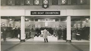 Black and white image of RNLI display in Charing Cross Underground Station