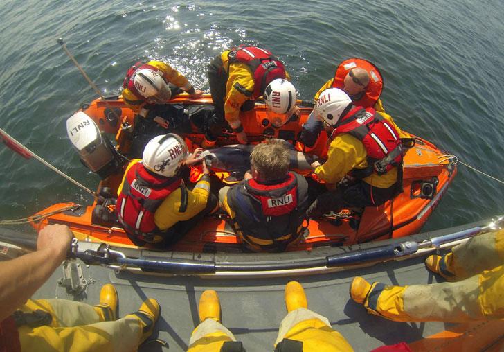 A rescued dolphin is released back into the sea by Flint and Rhyl lifeboat crews