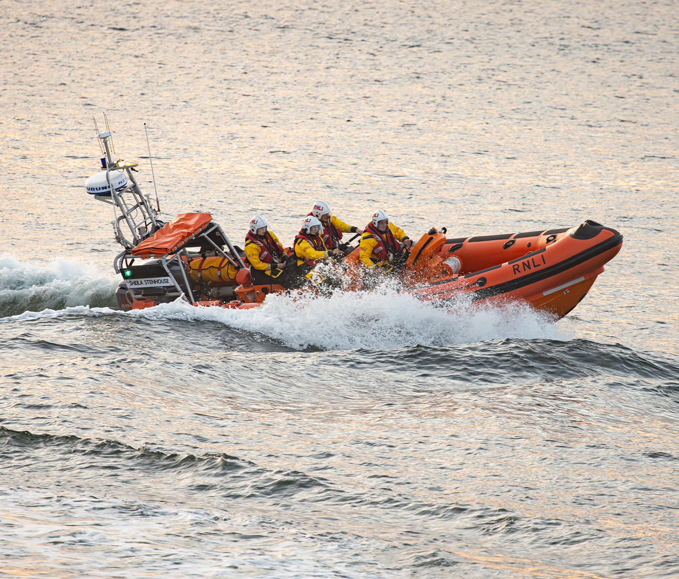 Inshore Lifeboat out at sea, making a turn