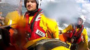 Two crew members from Fowey RNLI in their inshore lifeboat