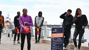Black Swimming Association members learning throw bag training at the RNLI College in Poole