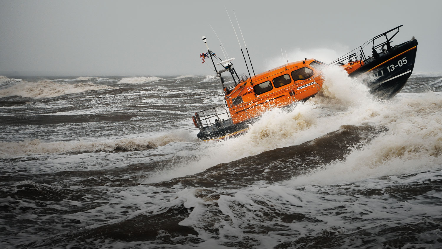 Shannon class lifeboat crashing into rough seas