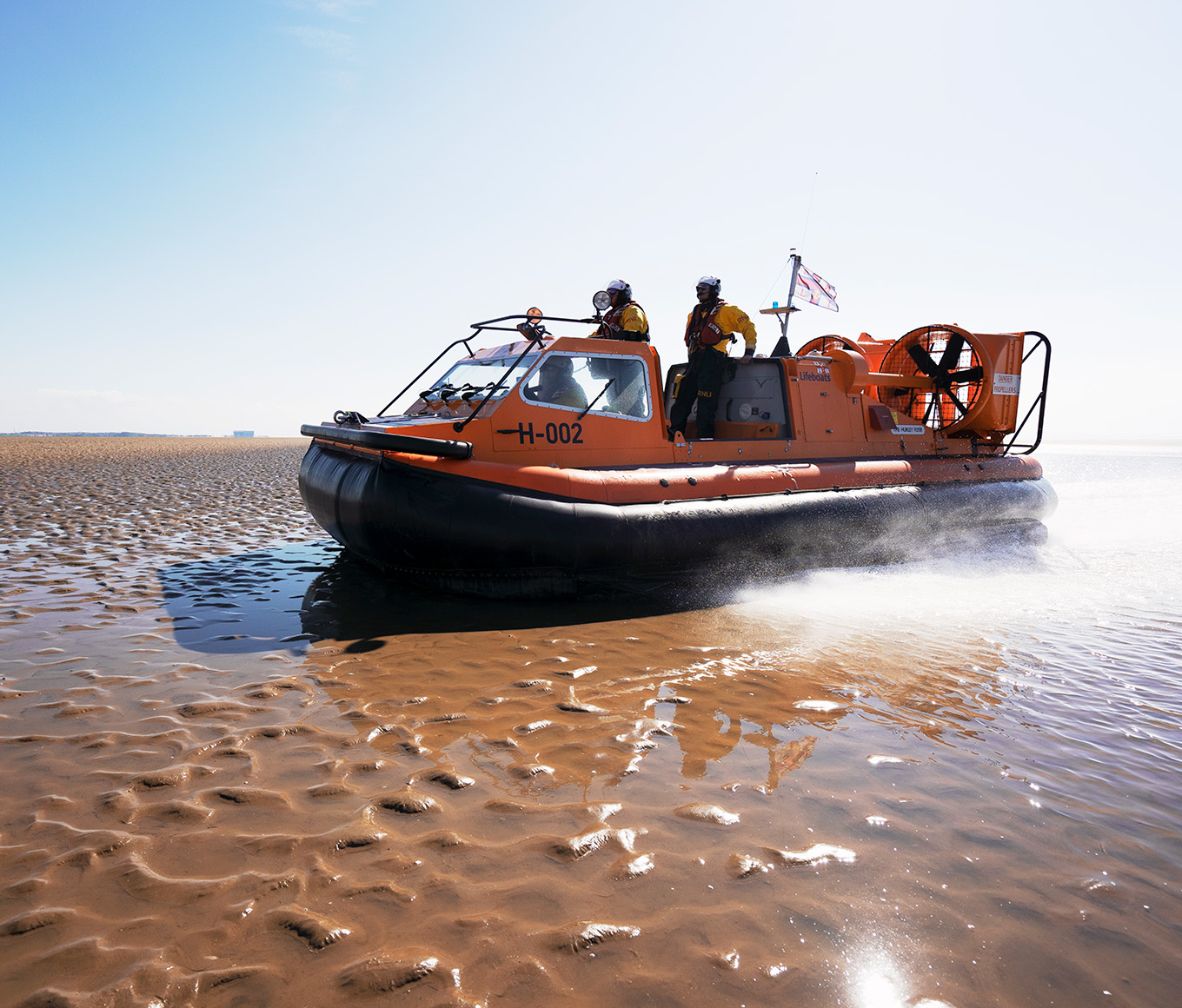 Morecambe hovercraft on a beach on a bright sunny day.