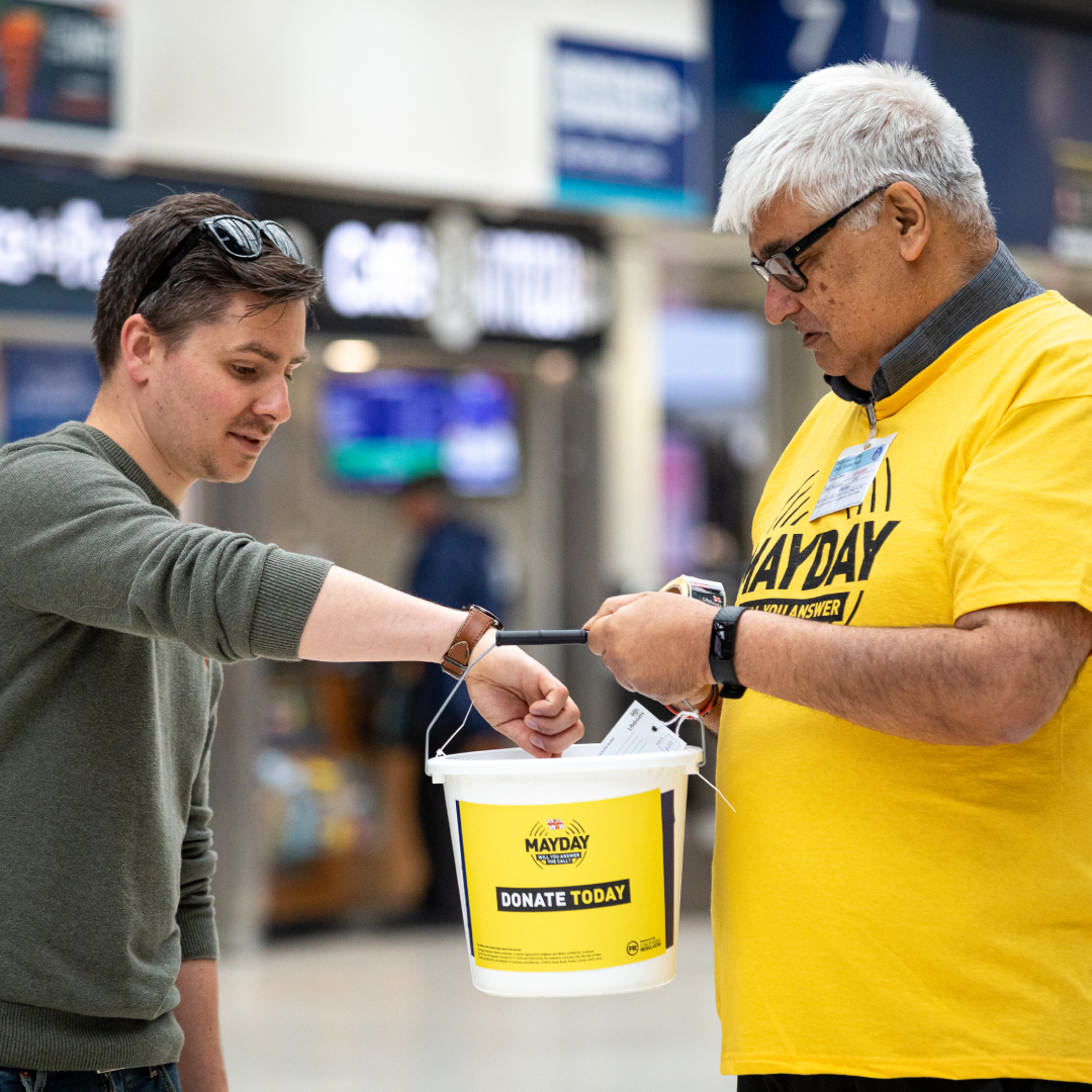 RNLI fundraising volunteer Suresh Bharwaney collecting at Waterloo train station.