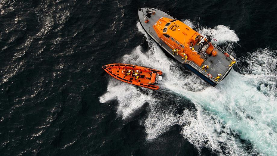 Two crewed lifeboats out on the sea
