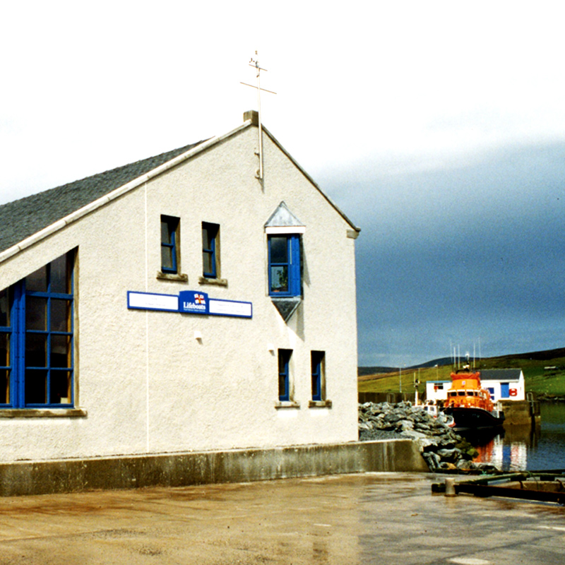 Aith lifeboat station with their Severn class lifeboat docked nearby