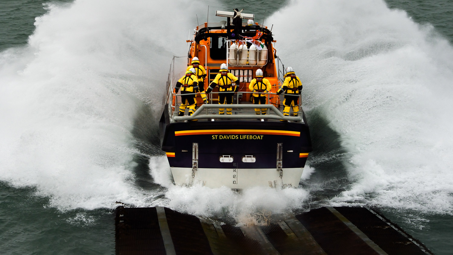 Tamar class lifeboat launches from slipway into the sea