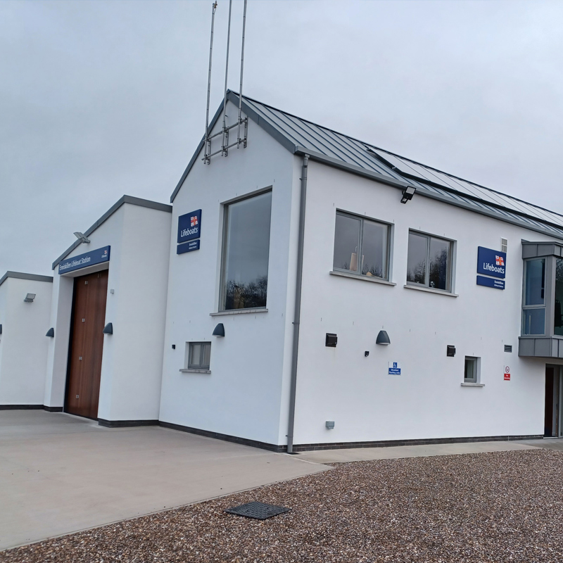 Exterior view of Enniskillen’s new lifeboat station with crew room and closed boathouse doors