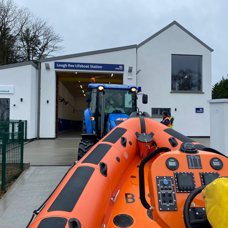 A tractor pushes a B class lifeboat out of Lough Ree’s boathouse