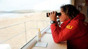 Lifeguard using binoculars 